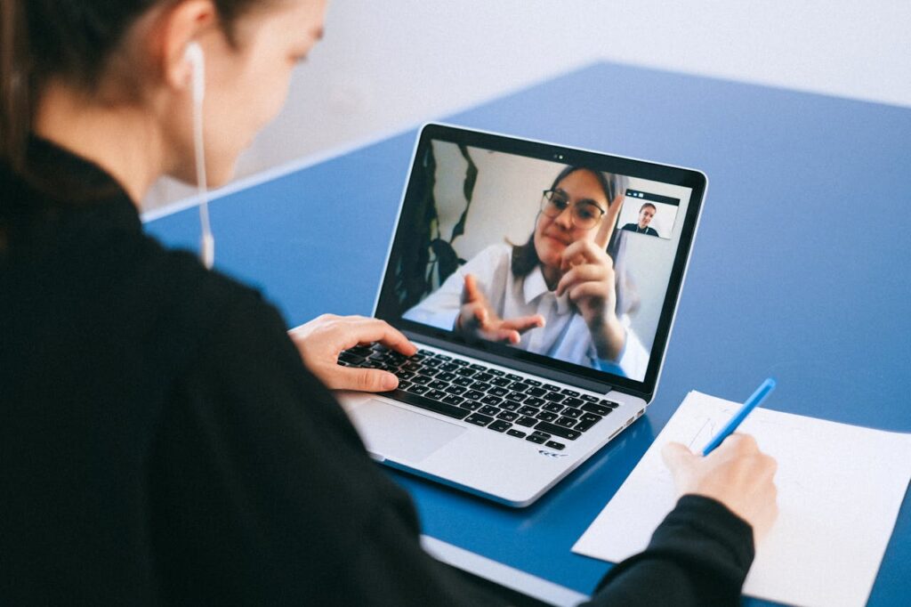 A person on a laptop having a video conference call